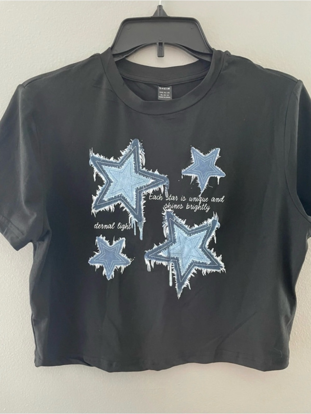 SHEIN Black Tee with Light Blue Star Appliqués